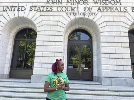 Teliah Perkins stands in front of the federal appeals court building in New Orleans, May 3, 2023, following a hearing on her lawsuit against two St. Tammany Parish, La., sheriff's deputies stemming from her arrest in May 2020. In an opinion issued Thursday, Nov. 30, a federal appeals court largely sided with the two white Louisiana sheriff's deputies in a lawsuit filed by Perkins, a Black woman, who accused them of using excessive force against her outside her home as they investigated an allega