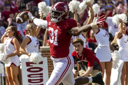 Alabama linebacker Will Anderson Jr. (31) runs back an interception for a touchdown against Louisiana-Monroe during the first half of an NCAA college football game, Saturday, Sept. 17, 2022, in Tuscaloosa, Ala. (AP Photo/Vasha Hunt)