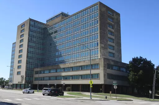 This photo from Tuesday, Sept. 20, 2022, shows the Robert B. Docking State Office building in Topeka, Kansas, named for a Kansas governor. Despite its prime location near the Kansas Statehouse, it's largely vacant and in need of renovations, and the state now plans to spend $60 million in pandemic relief funds to tear it down and build a smaller events center on the site. (AP Photo/John Hanna)