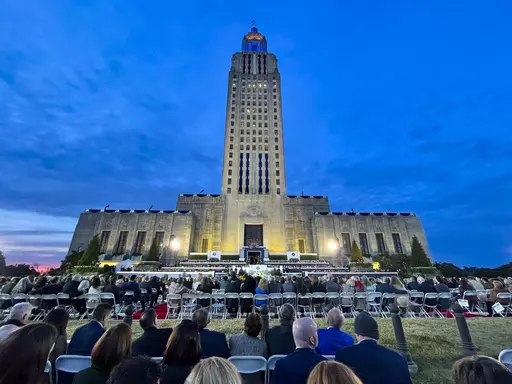 People listen to Louisiana Republican Gov. Jeff Landry speak during his inauguration ceremony at the State Capitol building in Baton Rouge, La., Sunday, Jan. 7, 2024. The inauguration, originally scheduled for Monday, was pushed up a day early due to weather concerns. (AP Photo/Matthew Hinton)