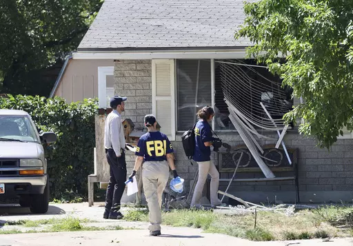 Law enforcement investigate the scene of a shooting involving the FBI, Aug. 9, 2023 in Provo, Utah. This week's confrontation that ended with FBI agents fatally shooting a 74-year-old Utah man who threatened to assassinate President Joe Biden was just the latest example of how violent rhetoric has created a more perilous political environment across the U.S. (Laura Seitz/The Deseret News via AP, File)
