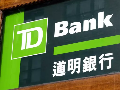 A branch of TD Bank is shown in the Chinatown neighborhood of New York, March 10, 2015. TD Bank is buying regional bank First Horizon in a $13.4 billion all-cash deal that will help broaden its reach in the southeastern U.S. TD Bank Group will pay $25 per First Horizon Corp. share. (AP Photo/Mark Lennihan)