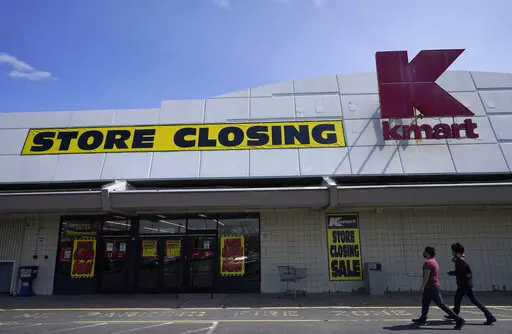 People walk into a Kmart in Avenel, N.J., Monday, April 4, 2022. When the New Jersey store closes its doors on April 16, it will leave only three remaining U.S. locations for the former retail powerhouse. It's a far cry from the chain's heyday in the 1980s and ‘90s when it had more than 2,000 stores and sold product lines endorsed by Martha Stewart and former “Charlie's Angel” Jaclyn Smith. (AP Photo/Seth Wenig)