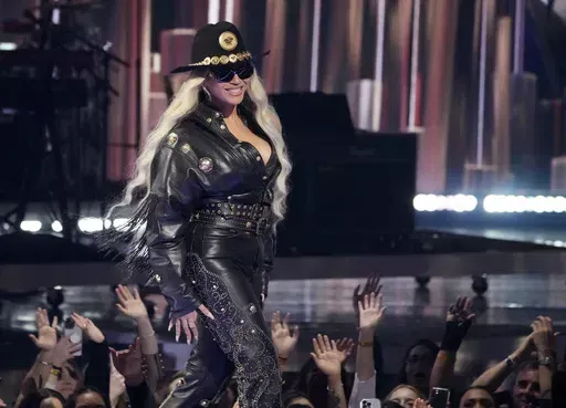 Beyonce walks onstage to accept the Innovator Award during the iHeartRadio Music Awards, Monday, April 1, 2024, at the Dolby Theatre in Los Angeles. (AP Photo/Chris Pizzello)