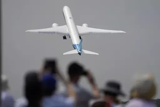 A Boeing 777X plane takes off at the Farnborough Air Show fair in Farnborough, England, on July 18, 2022. The cost of your next flight is likely to go up. That's the word from the International Air Transport Association, which held its annual meeting Monday June 3, 2024 in Dubai, home to the long-haul carrier Emirates. (AP Photo/Frank Augstein, File)