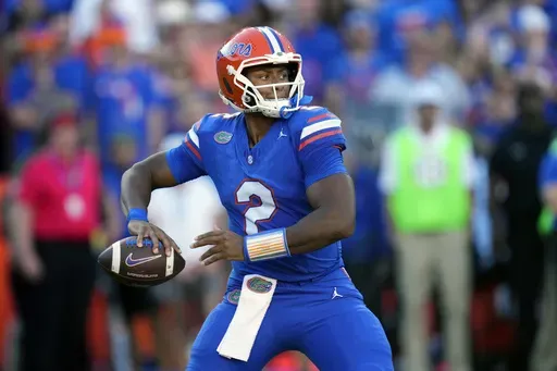 Florida quarterback DJ Lagway looks for a receiver during the first half of an NCAA college football game against LSU, Saturday, Nov. 16, 2024, in Gainesville, Fla. (AP Photo/John Raoux)