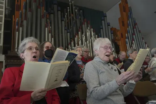 Members of the choir at Central Moravian Church sing at a “Lovefeast” service in Bethlehem, Pa., on Sunday, Dec. 1, 2024. (AP Photo/Luis Andres Henao)