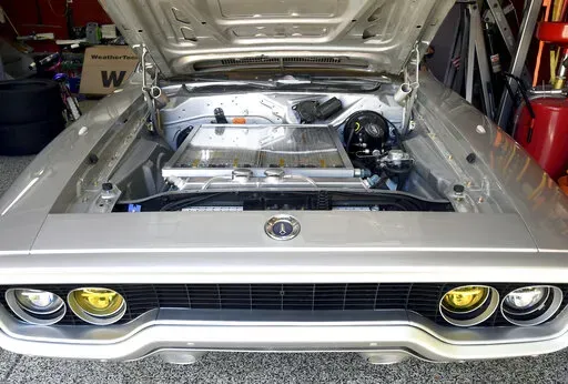 Kevin Erickson's electrified 1972 Plymouth Satellite is seen at his Commerce City, Colo., home on Sept. 20, 2022. Erickson is part of a small but expanding group of tinkerers, racers, engineers, and entrepreneurs across the country converting vintage cars and trucks into greener, often much faster, electric vehicles. (AP Photo/Thomas Peipert)