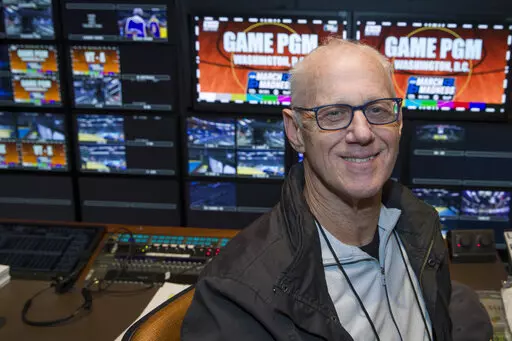 CBS director Bob Fishman poses in the production truck in Washington on March 28, 2019. Fishman, who has directed the NCAA Tournament since it was acquired by CBS, will direct his last Final Four for CBS and Turner this weekend. The fact that the tournament is in New Orleans is fitting since that is where Fishman's first Final Four took place. (AP Photo/Alex Brandon, File)