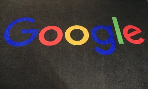 In this Monday, Nov. 18, 2019 file photo, the logo of Google is displayed on a carpet at the entrance hall of Google France in Paris. Google will automatically purge information about users who visit abortion clinics or other places that could trigger legal problems now that the U.S. Supreme Court has opened the door for states to ban the termination of pregnancies.  (AP Photo/Michel Euler, File)
