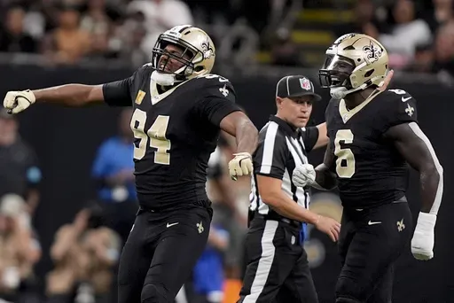 New Orleans Saints defensive end Cameron Jordan (94) celebrates a sack on Atlanta Falcons quarterback Kirk Cousins during the second half of an NFL football game, Sunday, Nov. 10, 2024, in New Orleans. (AP Photo/Gerald Herbert)