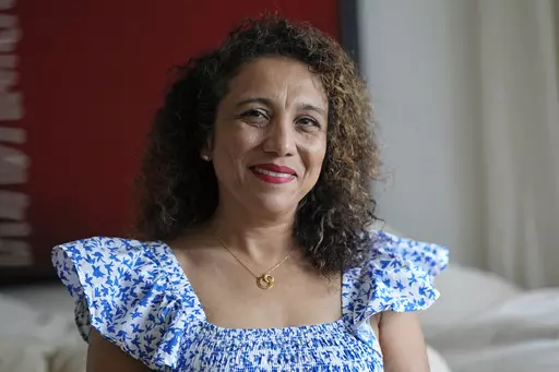 Monica Fulton poses at her home Monday, Nov. 20, 2023, in Houston. Fulton prioritizes giving to organizations that serve the city's residents, like the food bank, a homeless shelter and an arts education organization. The Tuesday after Thanksgiving, GivingTuesday started in 2012 as a hashtag and it has become a central part of nonprofit fundraising. (AP Photo/David J. Phillip)