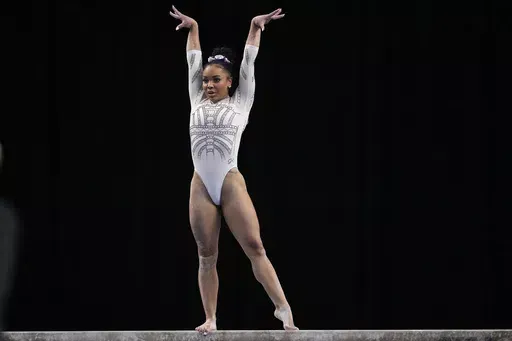LSU's Konnor McClain competes on the balance beam during the NCAA women's gymnastics championships in Fort Worth, Texas, Saturday, April 20, 2024. (AP Photo/Tony Gutierrez)