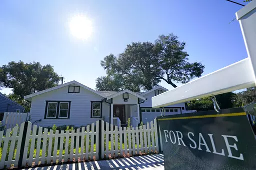 A home for sale is seen on Dec. 8, 2020, in Orlando, Fla. Sales of previously occupied U.S. homes fell in September 2022 for the eighth month in a row, matching the pre-pandemic sales pace from 10 years ago, as house hunters faced sharply higher mortgage rates, higher home prices and a still tight supply of properties on the market. (AP Photo/John Raoux, File)
