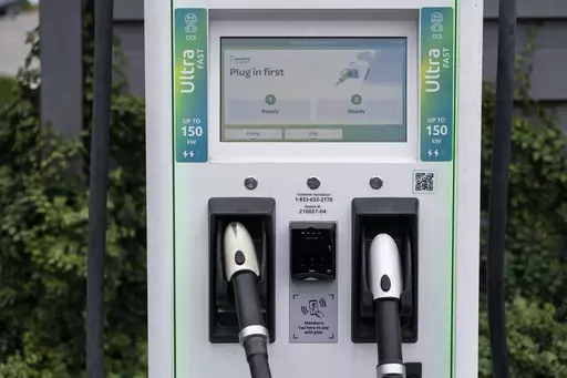 A charging station with Combined Charging System (CCS) plugs is seen in Anaheim, Calif., Friday, June 9, 2023. Owners of General Motors and Ford electric vehicles will be able charge at many of Tesla's large network of stations across the U.S. starting next year. (AP Photo/Jae C. Hong)