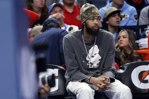 Injured Toronto Raptors forward Brandon Ingram watches from the bench during the first half of an NBA basketball game against the Oklahoma City Thunder, Friday, Feb. 7, 2025, in Oklahoma City. (AP Photo/Nate Billings)
