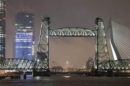 View of the Koningshaven Bridge, known as De Hef, (The Lift), in Rotterdam, Netherlands, Thursday, Feb. 3, 2022. A plan to dismantle the historic bridge in the heart of Dutch port city so that a huge yacht, reportedly being built for Amazon founder Jeff Bezos, can get to the North Sea is unlikely to be plain sailing. Reports this week that the city had already agreed to take apart the recently restored bridge sparked anger in the city, with one Facebook group set up calling for people to pelt th