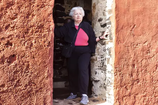 U.S. Treasury Secretary Janet Yellen stands in the "Door Of No Return" on Goree Island, Senegal, Saturday Jan. 21, 2023. Yellen has paid a solemn visit to an island off Senegal that is one of the most recognized symbols of the horrors of the Atlantic slave trade that trapped tens of millions of Africans in bondage. She is in Senegal as part of a 10-day trip aimed at rebuilding economic relationships between the U.S. and Africa. (AP Photo/Stefan Kleinowitz)
