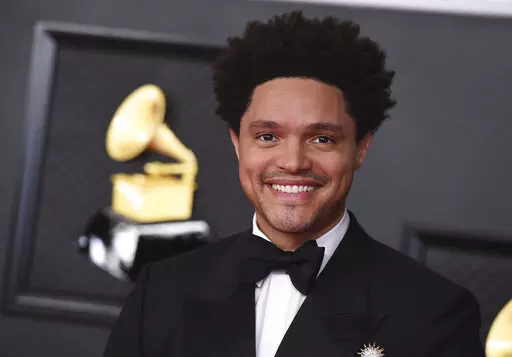 Trevor Noah appears at the 63rd annual Grammy Awards in Los Angeles on March 14, 2021. Noah is hosting the Grammy Awards for a third-straight year. (Photo by Jordan Strauss/Invision/AP, File)