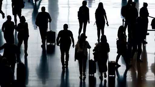 People pass through Salt Lake City International Airport, June 27, 2022, in Salt Lake City. The cost of travel has fluctuated sharply in recent years, but travelers expecting high prices now might be in for a pleasant surprise. Data show that many travel expenses, including airfare, have decreased recently. Domestic flights in particular have been less expensive, and while international airfare remains elevated, it too is coming down as airlines slowly add more capacity. (AP Photo/Rick Bowmer, f