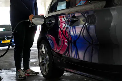 Motorists in the Netherlands headed to the pumps after a government reduction in duties on fuel entered into force to help motorists hit by soaring fuel prices, in Amsterdam, Netherlands, Friday, April 1, 2022. Inflation hit a new record for the 19 countries that use the euro as skyrocketing fuel prices boosted by the war in Ukraine add new burdens to household finances and weigh on a slowing economic recovery from the latest outbreaks of COVID-19, the European Union's statistics agency Eurostat