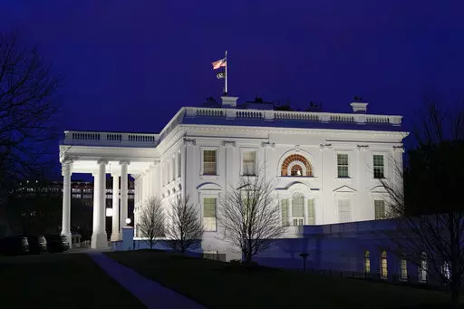 Dusk settles over the White House in Washington, Wednesday, March 30, 2022. (AP Photo/Patrick Semansky)
