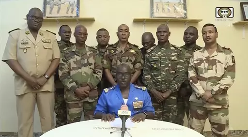 In this image taken from video provided by ORTN, Col. Maj. Amadou Abdramane, front center, makes a statement on July 26, 2023, in Niamey, Niger, as a delegation of military officers appeared on Niger State TV to read out a series of communiques announcing their coup d'etat. The U.S. is scrambling to assess the future of its counterterrorism operations in the Sahel region of Africa after the ruling junta in Niger announced it was ending military cooperation with Washington. (ORTN via AP, File)