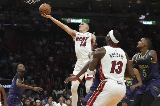 Miami Heat guard Tyler Herro (14) goes to the basket during the first half of an NBA basketball game against the New Orleans Pelicans, Wednesday, Jan. 1, 2025, in Miami. (AP Photo/Lynne Sladky)