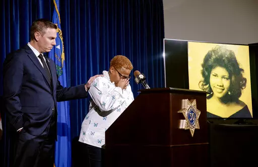 Teresa Board, sister of victim Pearl Wilson Ingram, is comforted by Metropolitan Police Department Lt. Jason Johansson as she talks about her sister's murder at a press conference about the cold case that is now closed after police connected DNA evidence to the killer at Metro Headquarters in Las Vegas, Monday, Feb. 6, 2023. (Rachel Aston/Las Vegas Review-Journal via AP)