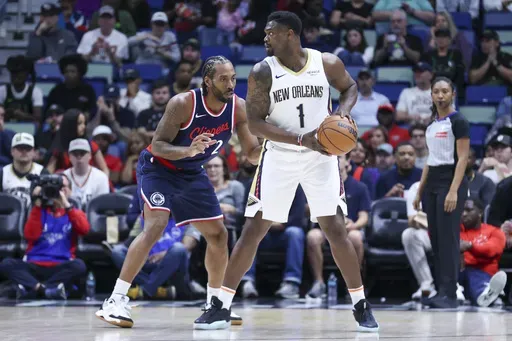 New Orleans Pelicans forward Zion Williamson (1) tries to make a move against Los Angeles Clippers forward Kawhi Leonard (2) in the first half of an NBA basketball game in New Orleans, Tuesday, March 11, 2025. (AP Photo/Peter Forest)