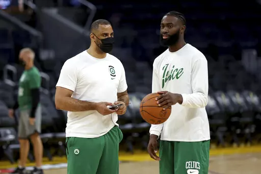 Boston Celtics guard Jaylen Brown, right, speaks with coach Ime Udoka during NBA basketball practice in San Francisco, Wednesday, June 1, 2022. The Golden State Warriors are scheduled to host the Celtics in Game 1 of the NBA Finals on Thursday. (AP Photo/Jed Jacobsohn)
