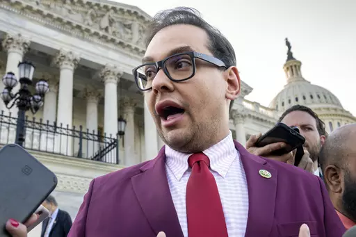 U.S. Rep. George Santos, R-N.Y., speaks to reporters outside the Capitol, in Washington, May 17, 2023. Santos, charged with a host of financial crimes, including embezzling money from his campaign, withdrew $85,000 from his campaign to help repay hundreds of thousands of dollars he loaned himself to get elected in 2022. (AP Photo/J. Scott Applewhite, File)
