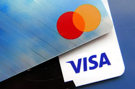 Credit cards as seen Thursday, July 1, 2021, in Orlando, Fla.  Paying for gifts, travel, entertaining and other holiday expenses has caused many of us to start off the new year in debt. The sooner you create a plan, the sooner you can leave that debt behind.  (AP Photo/John Raoux)