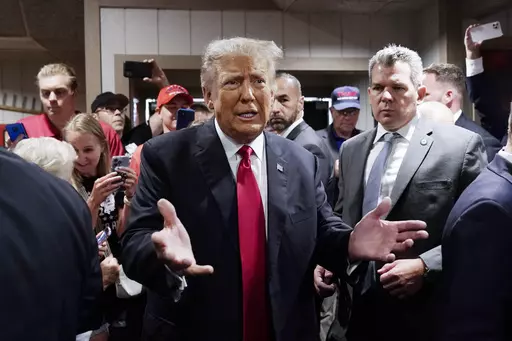Former President Donald Trump greets supporters before speaking at the Westside Conservative Breakfast, June 1, 2023, in Des Moines, Iowa. As Ron DeSantis embarked on the first official week of his presidential candidacy, the Florida governor repeatedly hit his chief rival, Trump, from the right. (AP Photo/Charlie Neibergall, File)