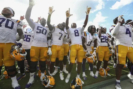 LSU celebrates a come from behind win after an NCAA college football game against South Carolina, Saturday, Sept. 14, 2024 in Columbia, S.C. LSU won 36-33. (AP Photo/Artie Walker Jr.)