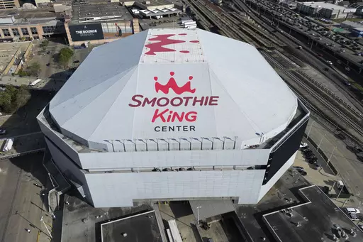An aerial overall exterior view of the Smoothie King Center appears before an NBA basketball game between the New Orleans Pelicans and the San Antonio Spurs in New Orleans, March 20, 2023. The Pelicans and Smoothie King have agreed to renew their arena naming rights contract, the club announced Tuesday, Dec. 26. (AP Photo/Tyler Kaufman, File)