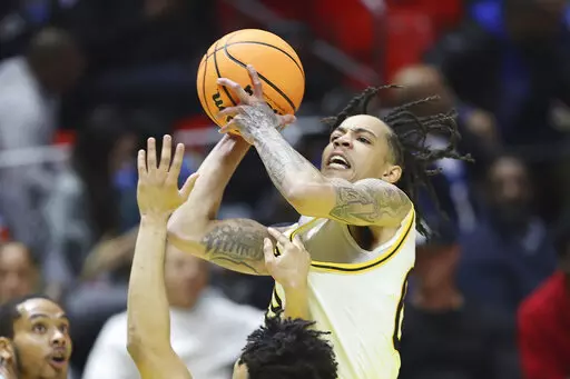 Grambling State guard Virshon Cotton, rear shoot the ball against Southern during the NBA All-Star HBCU classic college basketball game Saturday, Feb. 18, 2023, in Salt Lake City. (AP Photo/Rob Gray)