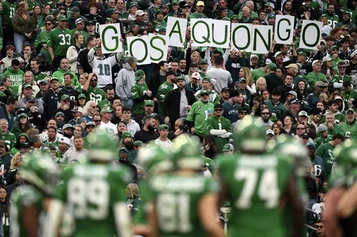 Philadelphia Eagles fans hold a sign that reads "Go Saquon Go" during the second half of an NFL football game against the Dallas Cowboys, Sunday, Dec. 29, 2024, in Philadelphia. (AP Photo/Terrance Williams, File)