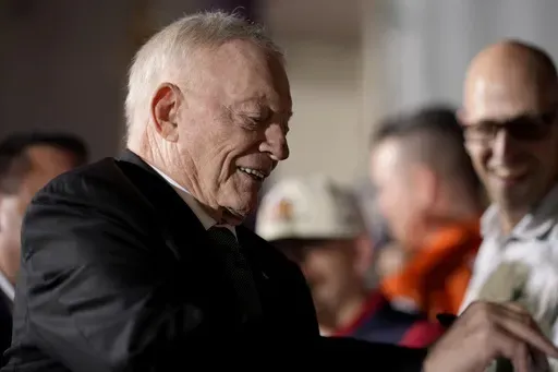 Dallas Cowboys owner Jerry Jones signs autographs along the red carpet at the NFL Honors award show ahead of the Super Bowl 59 football game, Thursday, Feb. 6, 2025, in New Orleans. (AP Photo/Brynn Anderson)