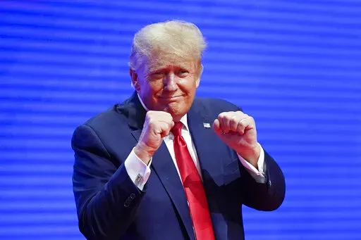 Former President Donald Trump, acknowledges supports after speaking at the Conservative Political Action Conference (CPAC) Saturday, Feb. 26, 2022, in Orlando, Fla. (AP Photo/John Raoux)