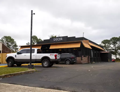 Dior Bar & Lounge on Bennington Avenue was the scene of an overnight shooting that left multiple people injured, Jan. 22, 2023, in Baton Rouge, La. On Friday, Feb. 10, police in Louisiana's capital city of Baton Rouge arrested two people for a mass shooting that left 12 others wounded at a nightclub in January. (Michael Johnson/The Advocate via AP)