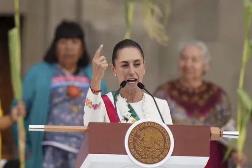 Newly-sworn in President Claudia Sheinbaum addresses supporters in the Zócalo, Mexico City's main square, on Oct. 1, 2024. (AP Photo/Fernando Llano, File)