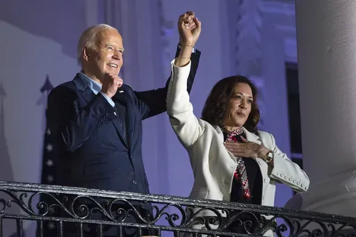 President Joe Biden raises the hand of Vice President Kamala Harris after viewing the Independence Day fireworks display over the National Mall from the balcony of the White House, Thursday, July 4, 2024, in Washington. She's already broken barriers, and now Harris could soon become the first Black woman to head a major party's presidential ticket after President Joe Biden's ended his reelection bid. The 59-year-old Harris was endorsed by Biden on Sunday, July 21, after he stepped aside amid wid
