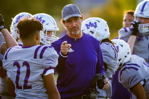Mount Vernon High School football coach Art Briles talks to players on the sideline Aug. 30, 2019, in Bonham, Texas. Grambling State football coach Hue Jackson has hired former Baylor coach Briles as offensive coordinator, the university confirmed Thursday, Feb. 24, 2022. Briles has not worked in college football since 2016, when he was fired by Baylor after an investigation concluded he and his staff took no action against players named in sexual assault allegations. (Smiley N. Pool/The Dallas 
