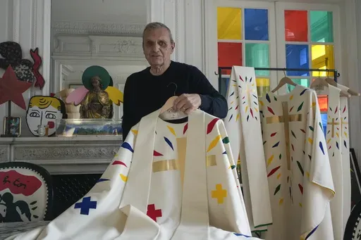 Designer Jean-Charles de Castelbajac displays a liturgical vestment for bishops to be worn at the reopening of Paris' Notre-Dame Cathedral in December, Wednesday, Nov. 20, 2024 in Paris. (AP Photo/Michel Euler)