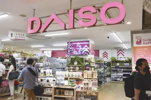 Shoppers visit a Daiso shop as the shop opened to the media in Tokyo, on April 13, 2022. Hirotake Yano, who founded the retail chain Daiso known for its 100-yen shops, Japan’s equivalent of the dollar store, has died. He was 80.(Kyodo News via AP)