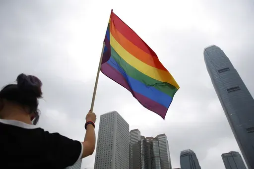 A participant holds a rainbow flag at the annual Pride Parade in Hong Kong, Nov. 17, 2018. (AP Photo/Kin Cheung, File)