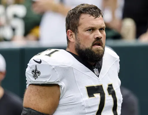 New Orleans Saints' Ryan Ramczyk walks on the field before an NFL football game against the Green Bay Packers, Sept. 24, 2023, in Green Bay, Wis. The Saints have placed right tackle Ramczyk on the reserve/physically unable to perform list that will cause him to miss at least the first four games of the regular season. (AP Photo/Jeffrey Phelps, File)