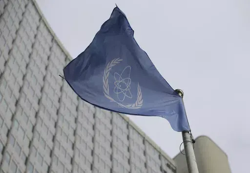 The flag of the International Atomic Energy Agency flies in front of its headquarters during an IAEA Board of Governors meeting in Vienna, Austria, Monday, Feb. 6, 2023. Iran has slowed its enrichment of uranium at nearly weapons-grade levels, a report by the United Nations' nuclear watchdog seen by The Associated Press said Monday, Sept. 4, 2023. (AP Photo/Heinz-Peter Bader, File)