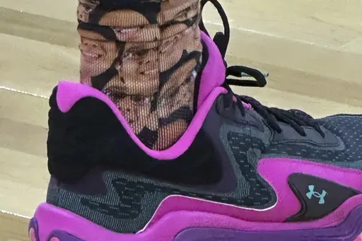 McNeese State guard Sincere Parker wears socks featuring team student manager Amir Khan during the first half in the first round of the NCAA college basketball tournament, Thursday, March 20, 2025, in Providence, R.I. (AP Photo/Jimmy Golen)